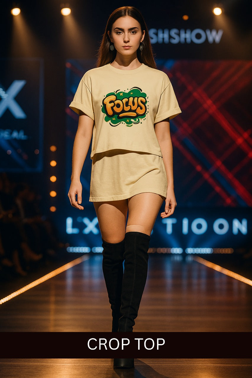 Female model walking runway wearing beige women crop top with Focus graphic and matching skirt