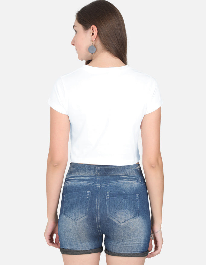 Back view of a woman wearing a white cute panda crop top and denim shorts