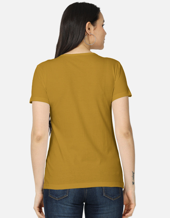 Back view of women's classic mustard Labubu character tee by ALPHA HUE paired with blue jeans