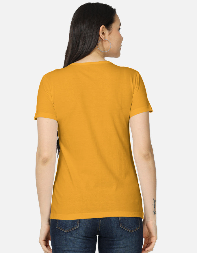 Back view of woman wearing ALPHA HUE women's classic Labubu character tee in mustard yellow