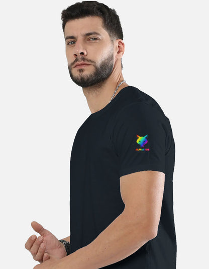 Alpha Hue men's stretch t-shirt in black worn by a bearded man with rainbow logo on sleeve