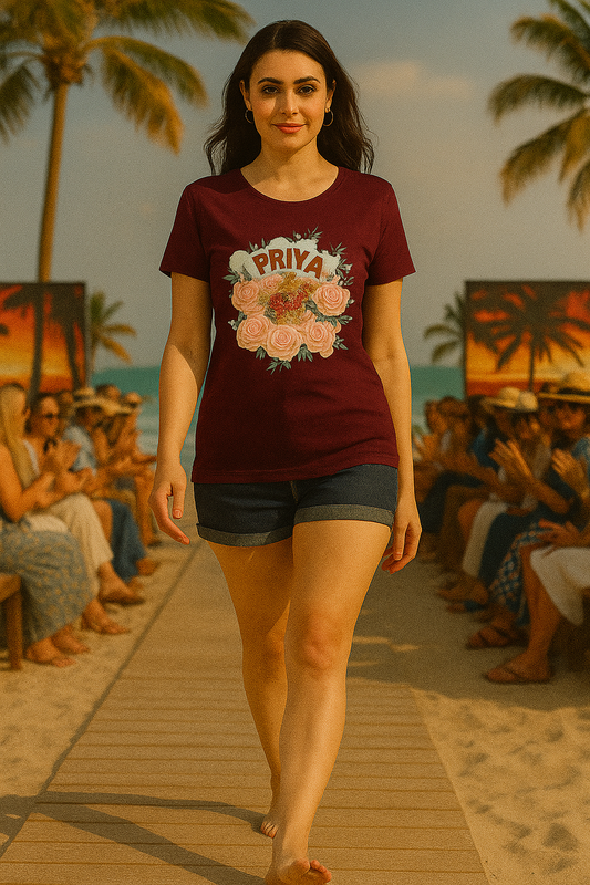 Woman wearing ALPHA HUE women's classic t-shirt with Priya floral design walking on beach runway