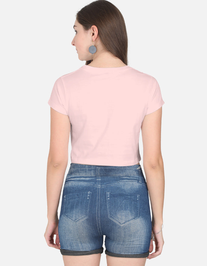 Alpha hue women's crop top in light pink shown from the back paired with denim shorts