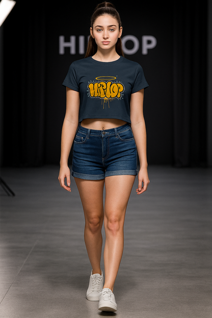 Alpha Hue women's graphic crop top in black with yellow hip hop print worn with denim shorts