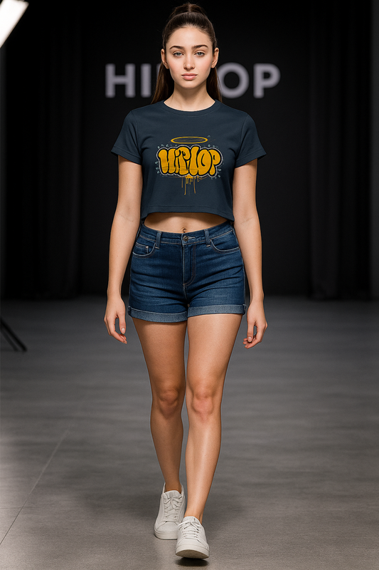 Alpha Hue women's graphic crop top in black with yellow hip hop print worn with denim shorts
