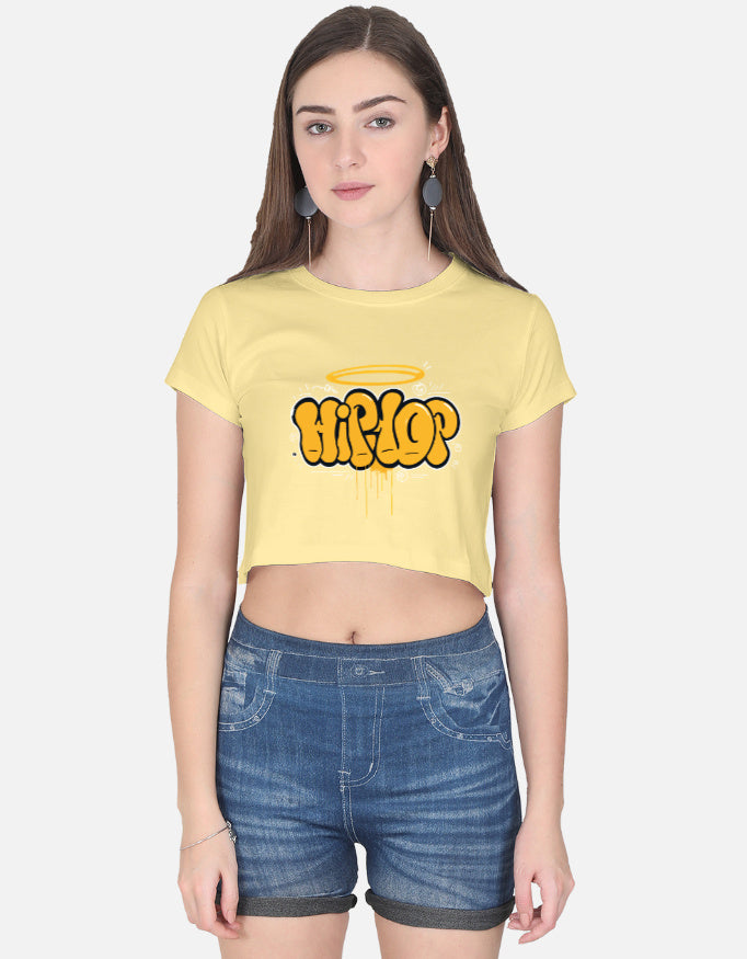 Alpha Hue women's graphic crop top in yellow with hip hop graffiti design styled with denim shorts