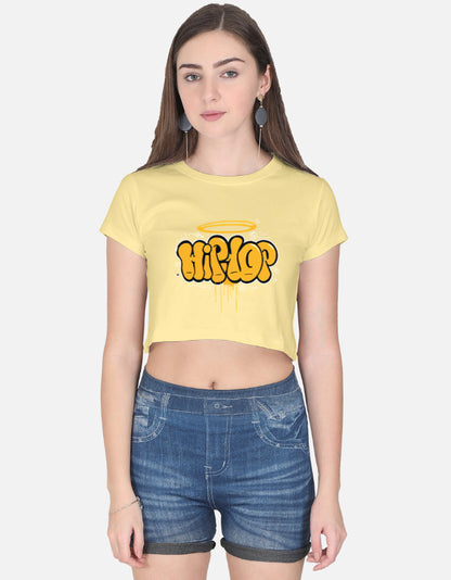 Alpha Hue women's graphic crop top in yellow with hip hop graffiti design styled with denim shorts