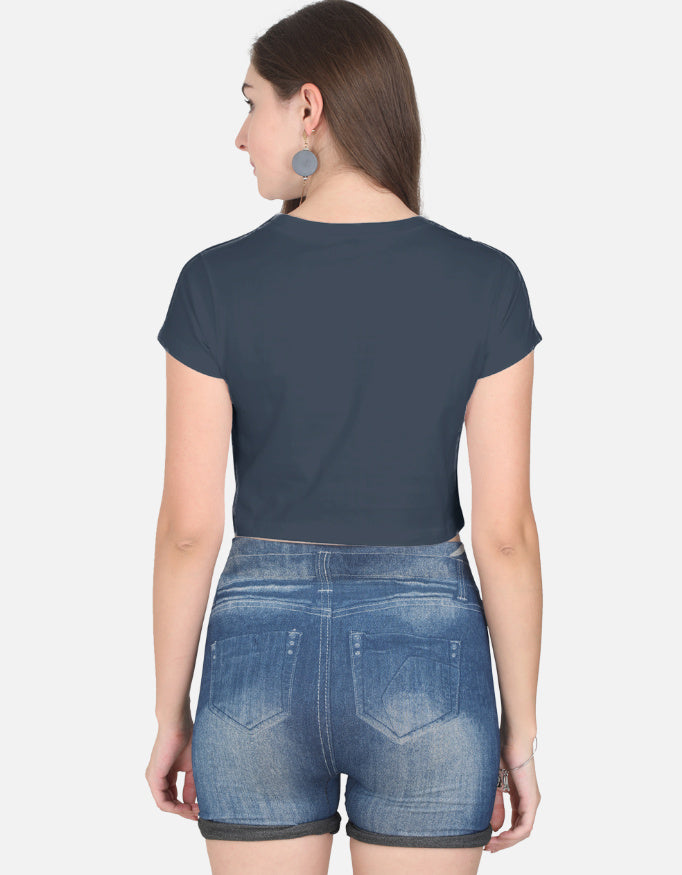 Alpha hue women's graphic crop top in navy blue shown from the back paired with denim shorts