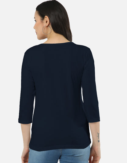 Back view of woman wearing navy ALPHA HUE women's long sleeve tee with 3 quarter sleeves