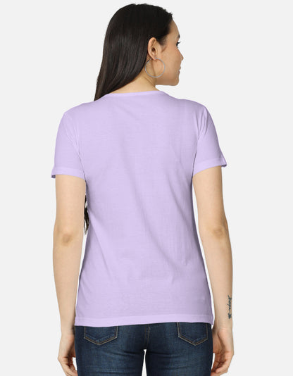 Back view of woman wearing alpha hue lavender women's classic t-shirt in casual denim jeans